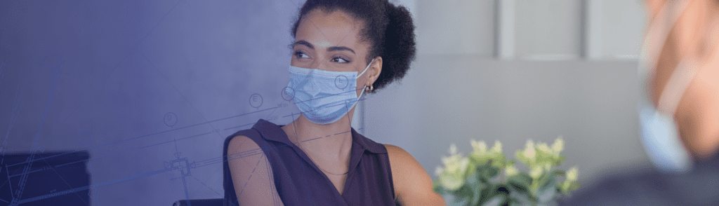 employee wearing mask as part of managing health risks in the workplace