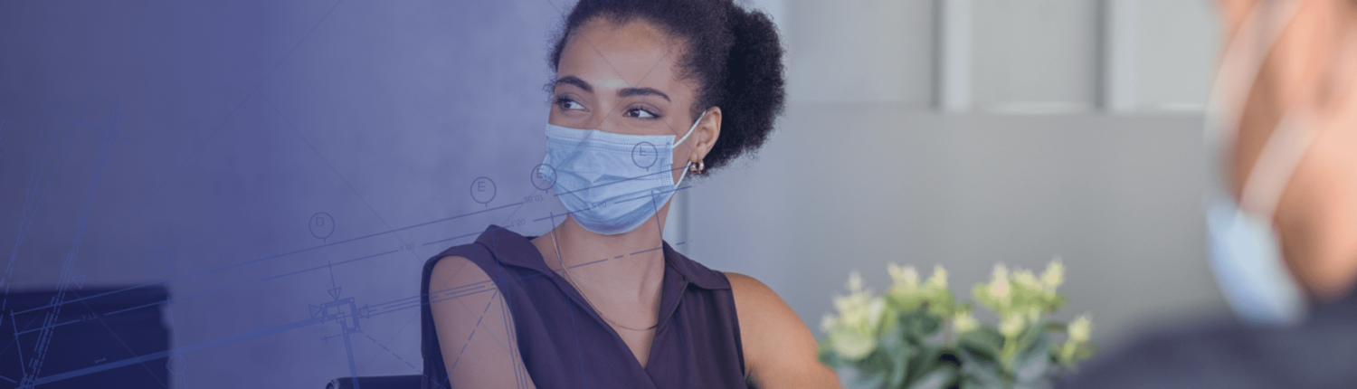 employee wearing mask as part of managing health risks in the workplace